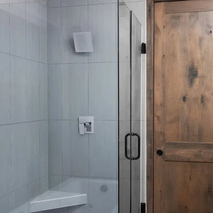 Bathroom with a ZLINE 8 in. Bliss Shower Head in Chrome (BLS-H8-CH) in a glass shower enclosure and wooden door
